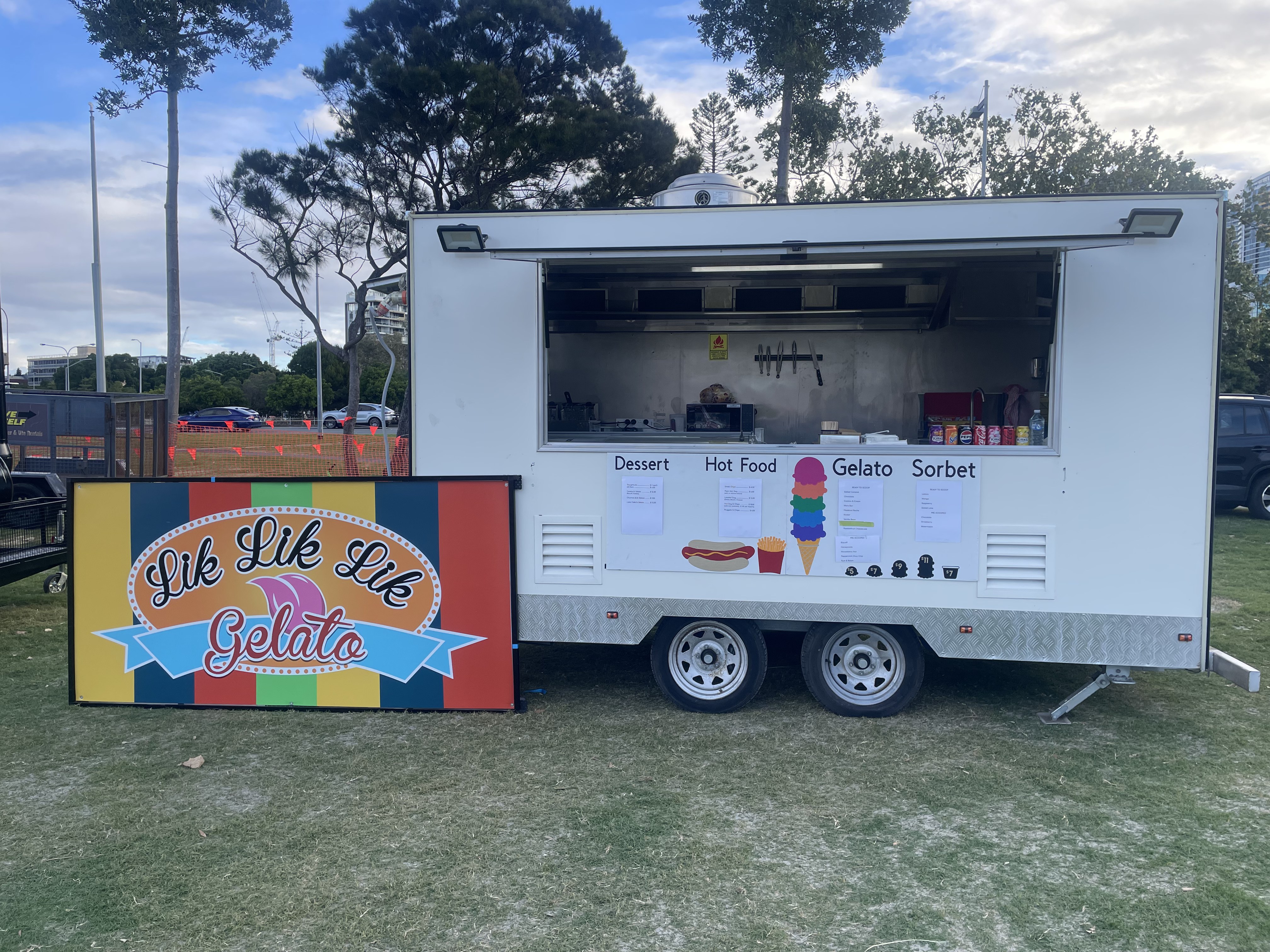 Lik Lik Lik trailer set up with menu board at a Gold Coast event