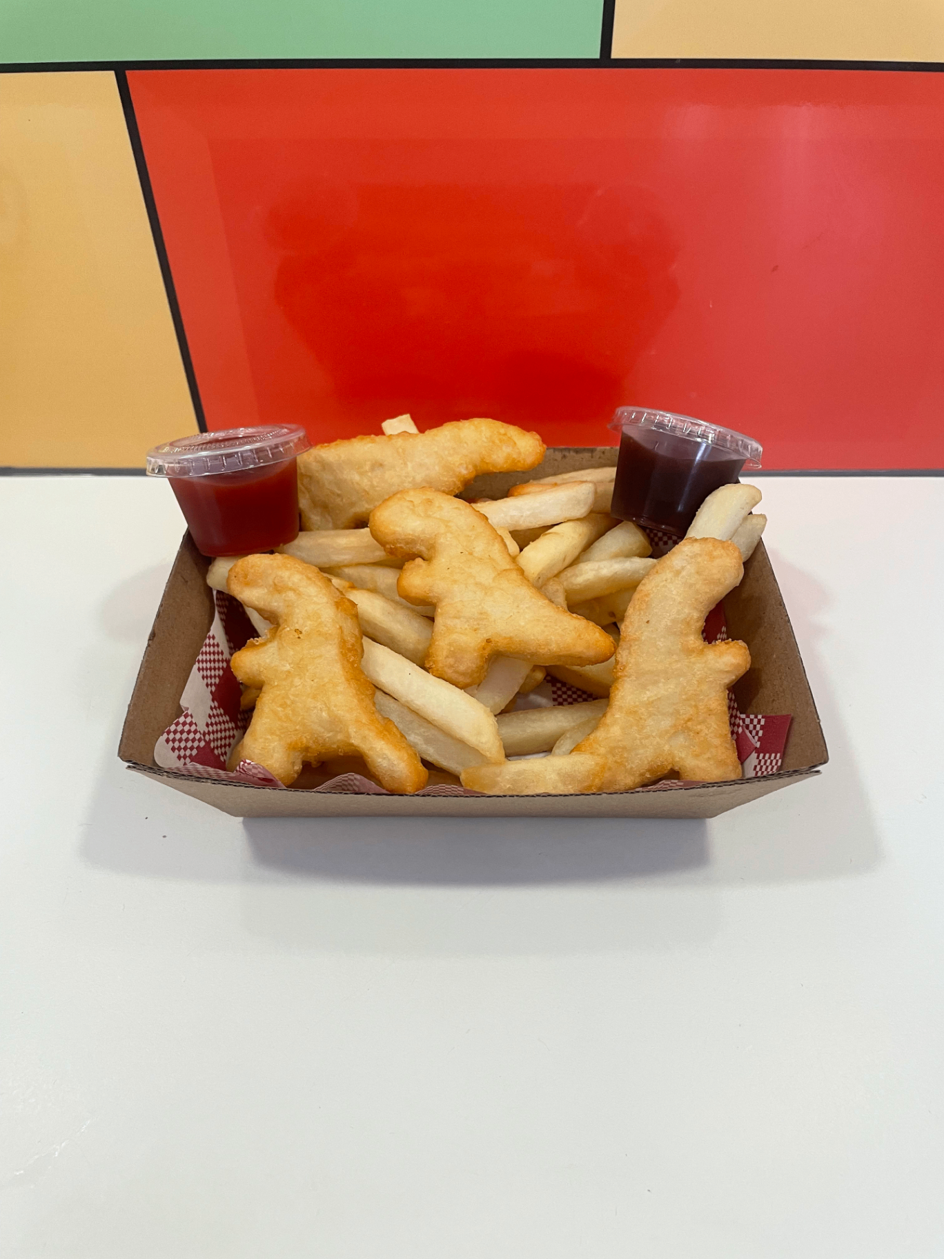 Dino-shaped chicken nuggets kids' meal