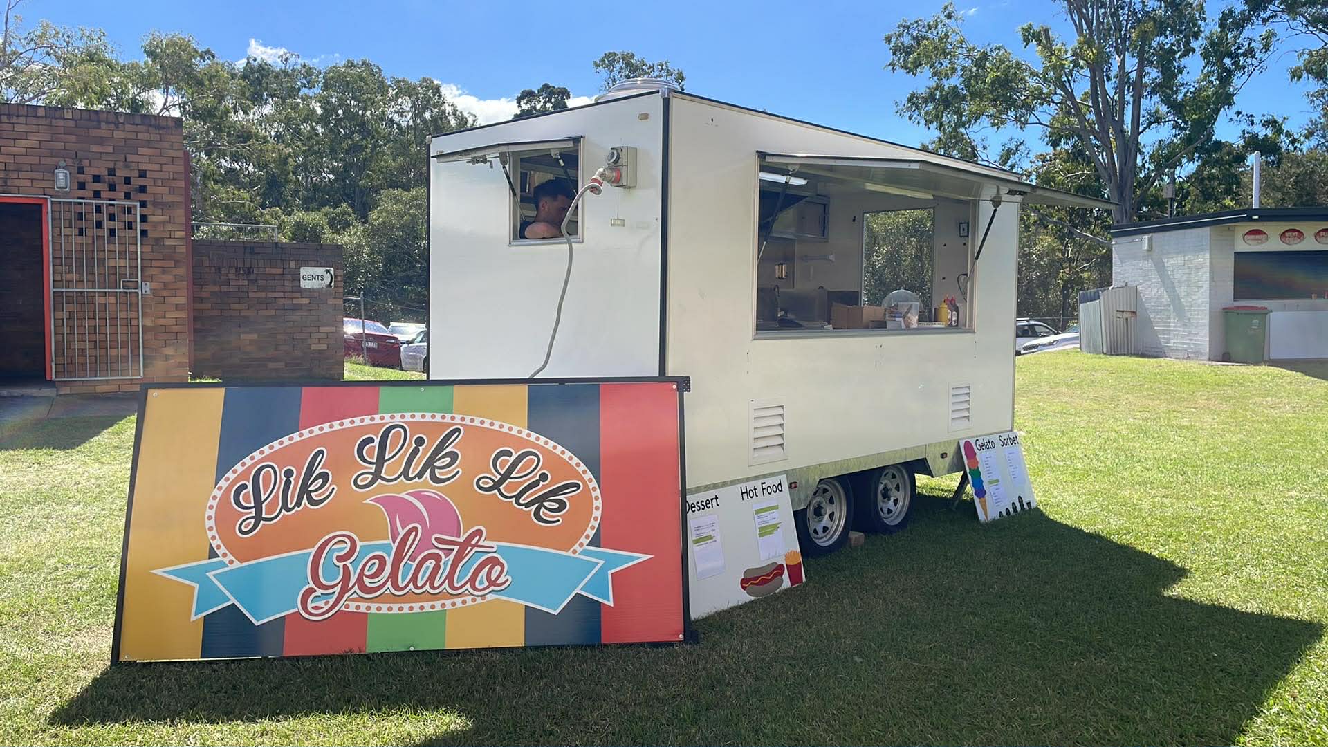 Lik Lik Lik trailer parked at a park with signage out front